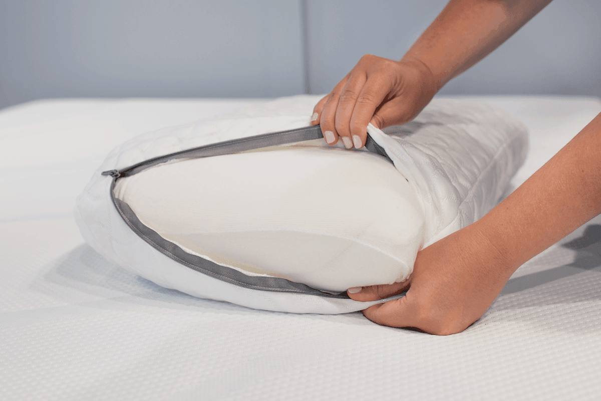 The washable cover being removed from a Tempur-Cloud pillow